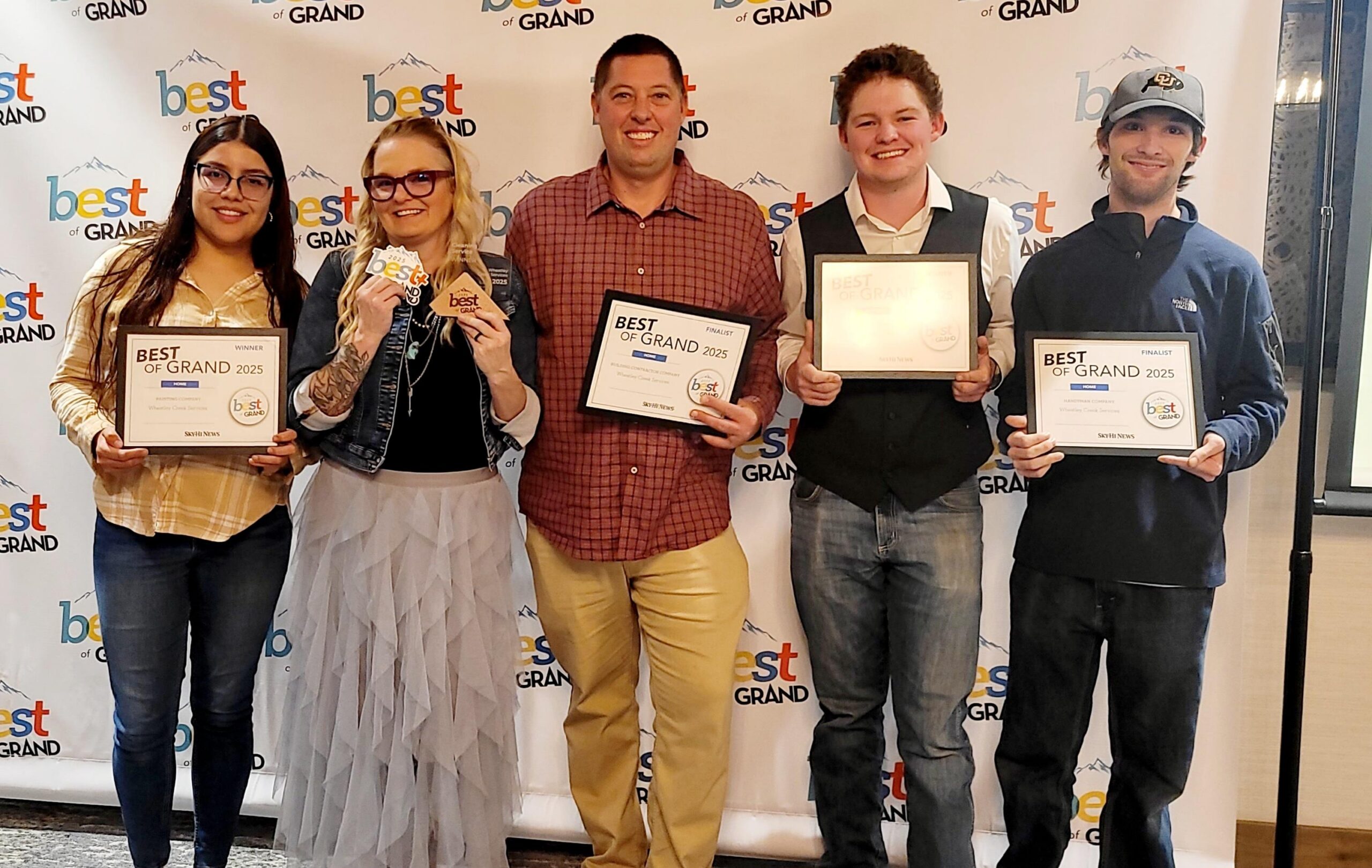 Wheatley Creek Services team holding their 2025 Best of Grand awards
